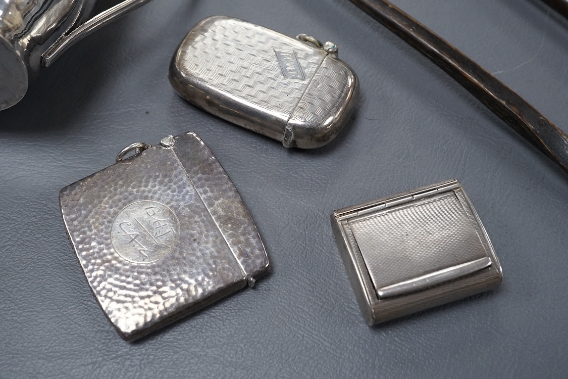 A small group of collectable silver including a George III silver cream jug, London, 1804, height 95mm, three silver vesta cases, two pill boxes, an envelope stamp case, two Georgian toddy ladles, one unmarked, together